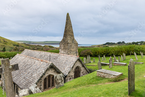 The Church of St Enodoc is located amongst sand dunes adjacent to the Cornish village of Trebetherick. photo