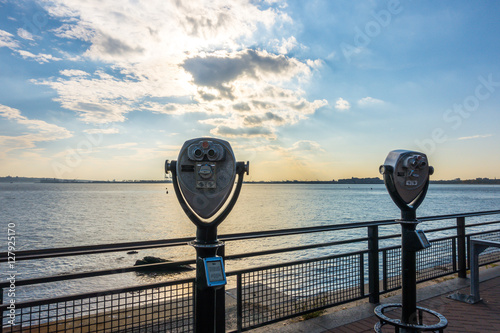 Tourist binoculars at Statue of Liberty, New York City , USA .