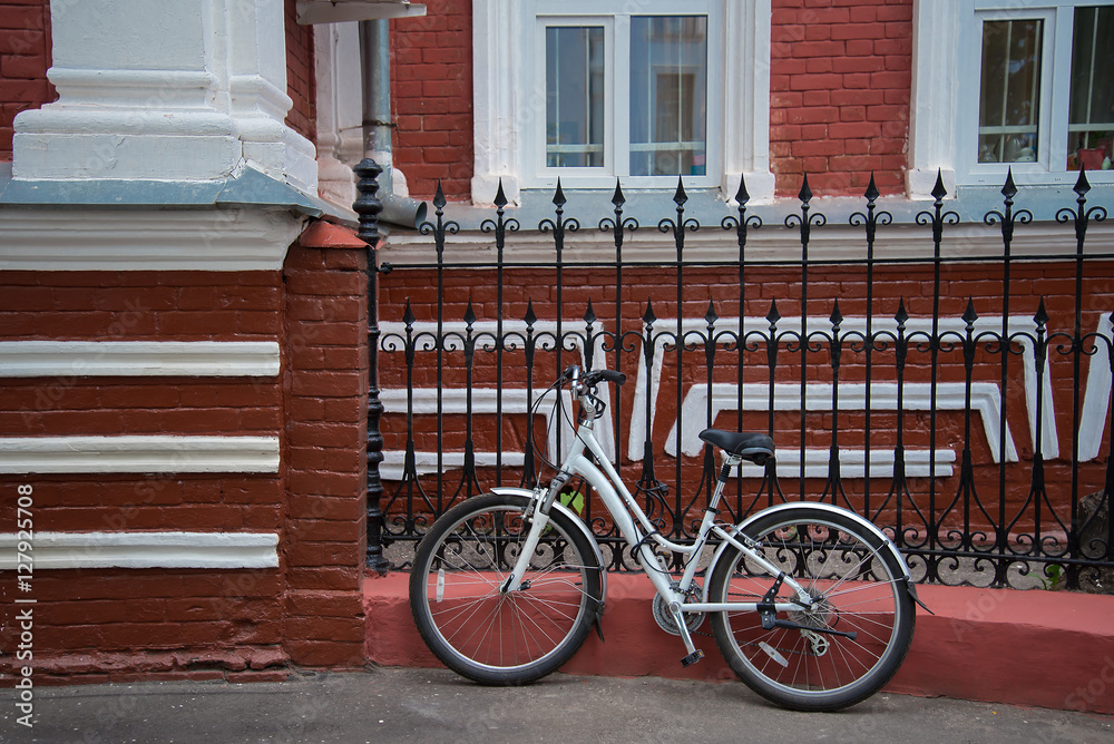 the bike near the red house