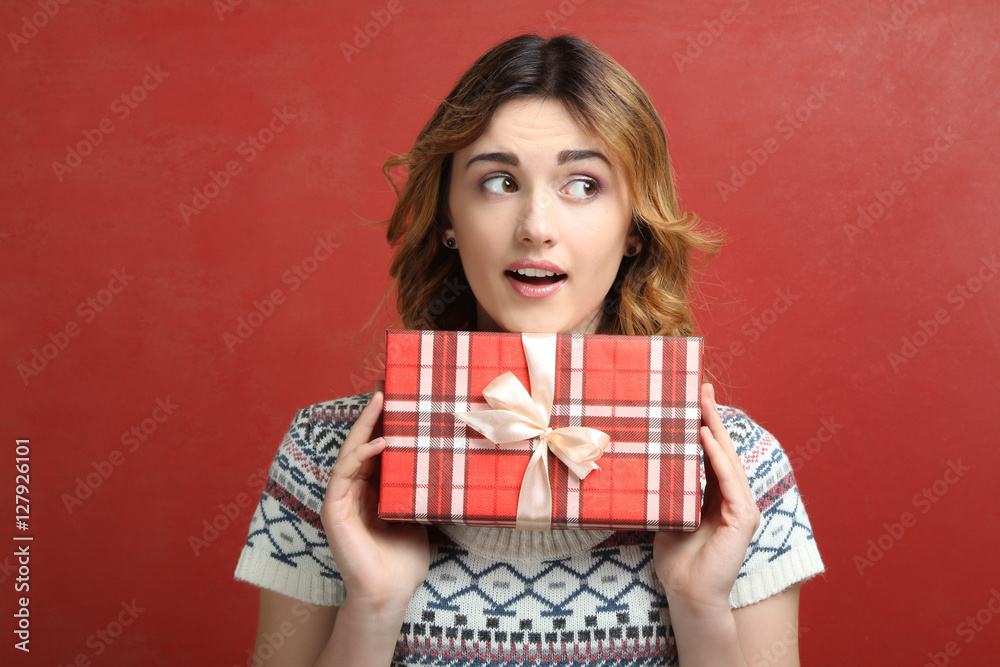 Portrait of a happy girl with a gift box in hands. Portrait of a happy girl with a gift box in hands.