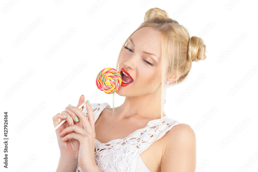 Beauty Model smiling teen girl, licking a lollipop, funny blonde hairstyle - two bumps, professional make-up. Snow-white teeth, blue eyes, long eyelashes. Isolated on white background
Beauty Model smiling teen girl, licking a lollipop, funny blonde hairstyle - two bumps, professional make-up. Snow-white teeth, blue eyes, long eyelashes. Isolated on white background