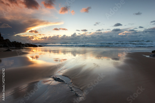 Reflection sunset on a isolated beach