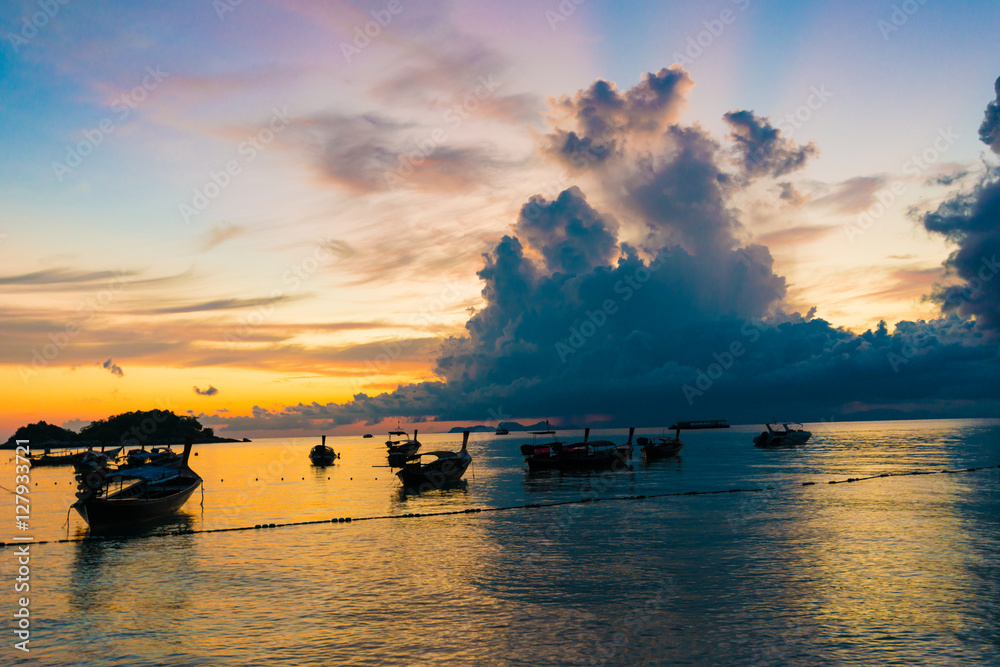Wooden fisherman boat with sky background on sunrise Stock Photo