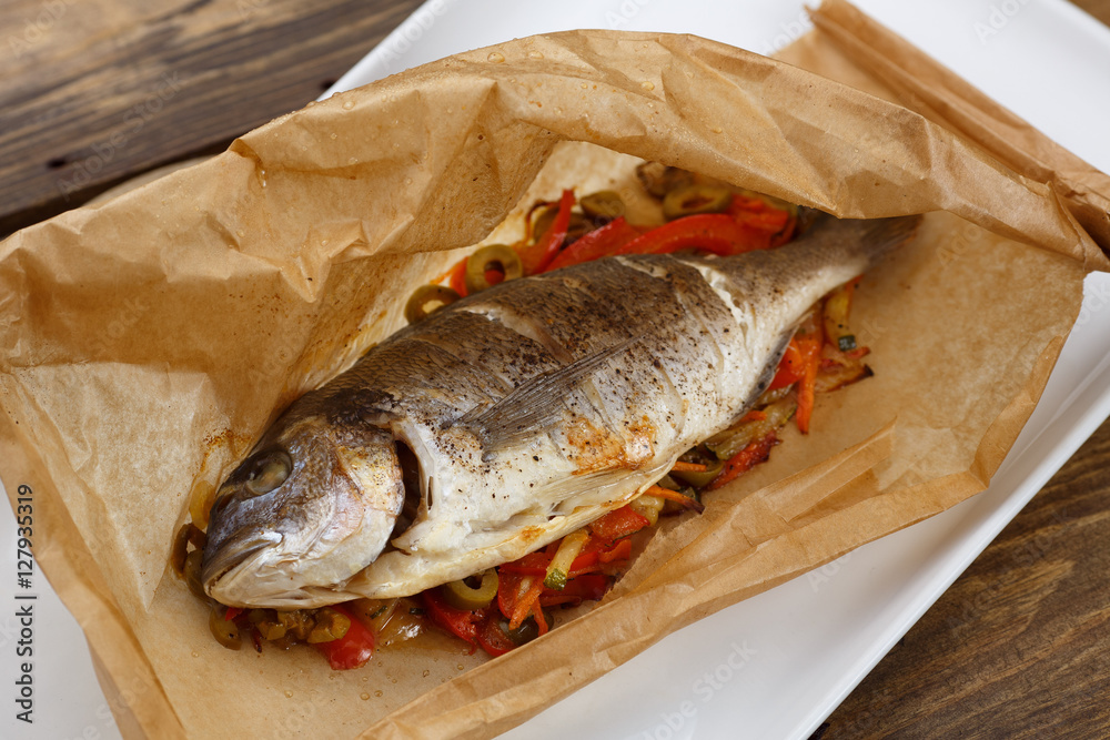 Baked in parchment sleeve fish with a vegetable Baked in parchment sleeve fish with a vegetable