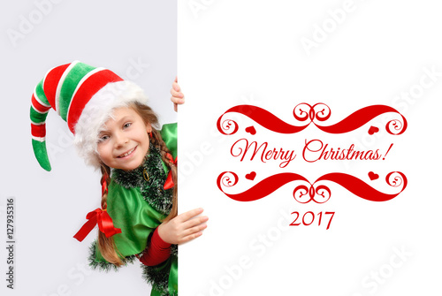 Girl Santa's elf with the white banner.