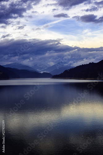 Landscape with dam lake Vidraru in Romanian mountains, in the wi © czamfir