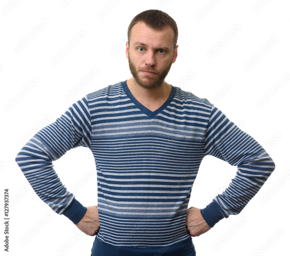 Serious man with arms on hips looking at camera