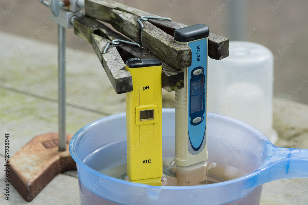 Measuring the pH of the water in hydroponic farm. Electronic pH