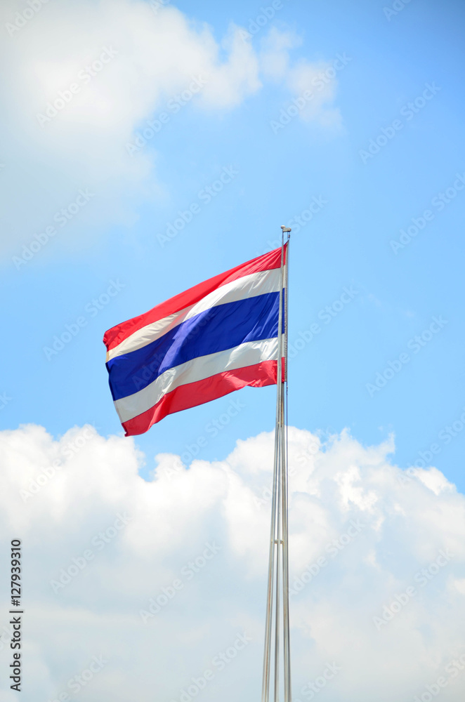 Thai flag against blue sky