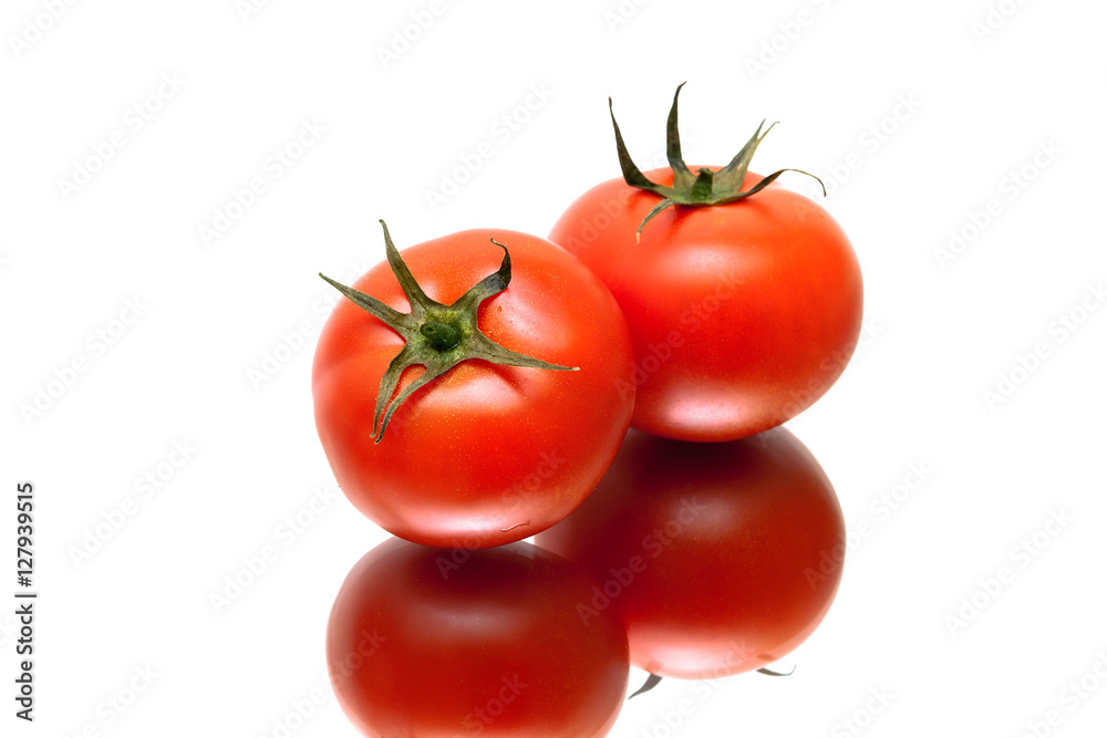 ripe tomatoes with reflection on white background ripe tomatoes with reflection on white background