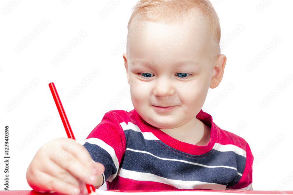 little boy 1 year draws red pencil, smiling to his mother. White background. family happiness little boy 1 year draws red pencil, smiling to his mother. White background. family happiness