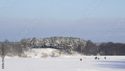 Fishermen catch fish on lake ice