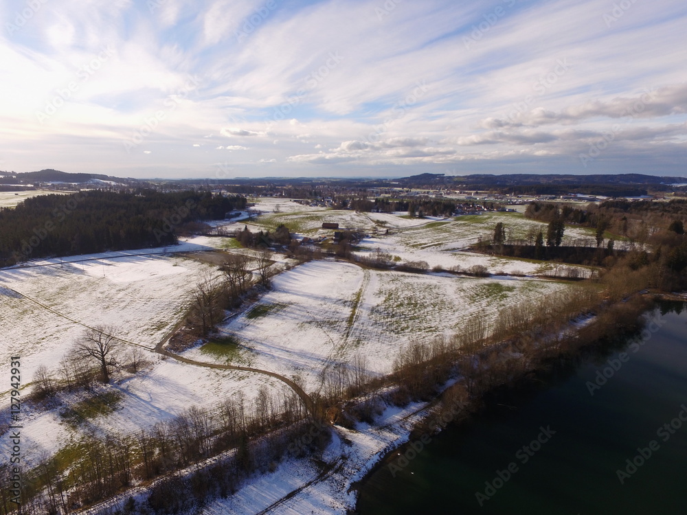 drone shot of lake in winter time
