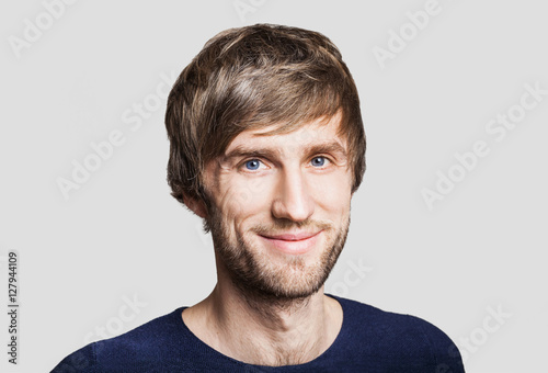 Cheerful smiling young man studio portrait