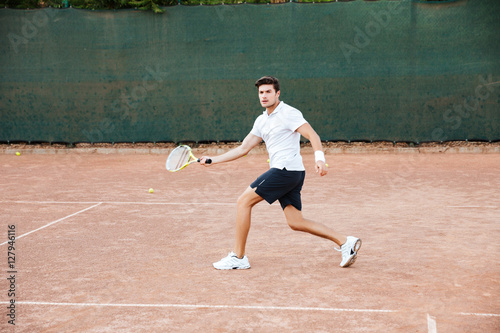Male tennis player in action © Drobot Dean