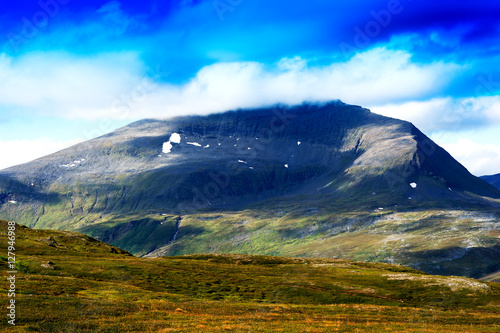 Norway mountain hill in clouds background