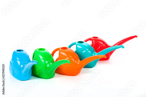 several color watering cans