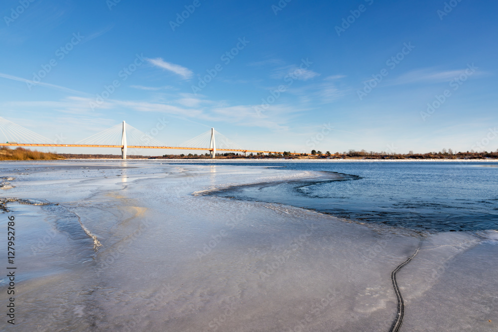 bridge in north of river covered with ice