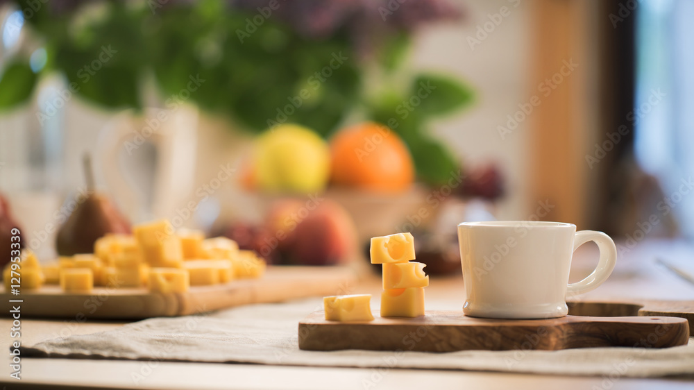 a piece of cheese with coffee on the house breakfast a piece of cheese with coffee on the house breakfast