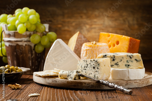 Canvas Print Mix cheese on wooden board.