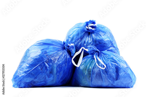 Blue rubbish bags isolated on white