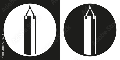 Punching bag icon. Silhouette punching bag on a black and white background. Sports Equipment. Vector Illustration.