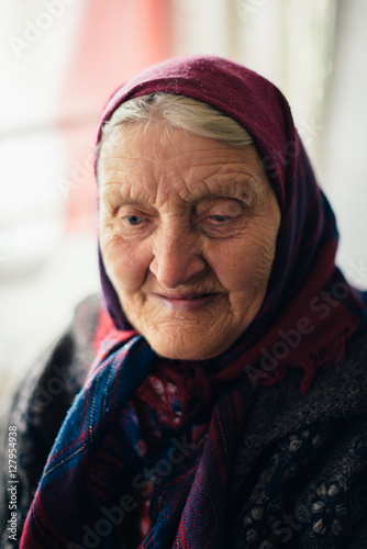 The old grandmother at home in Russian village