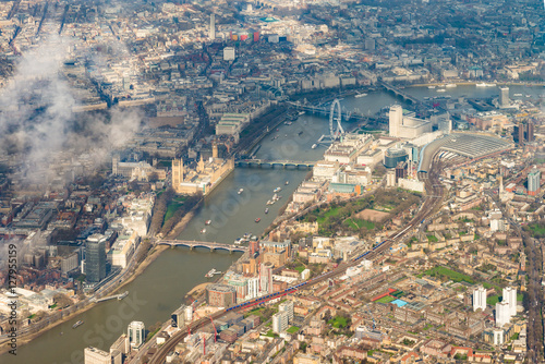 London, England  from above with the Thames, Houses of Parliament, London Eye, Waterloo and Charing Cross stations.