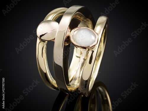Golden ring with gemstone isolated on black background