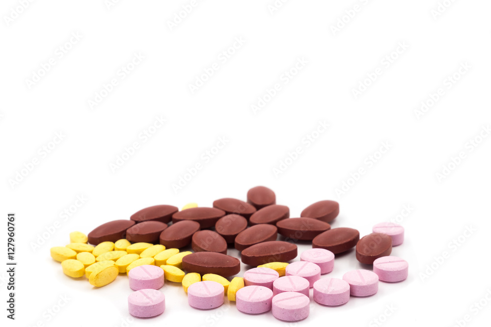 Lot of different medicine pills on white background. Lot of different medicine pills on white background.