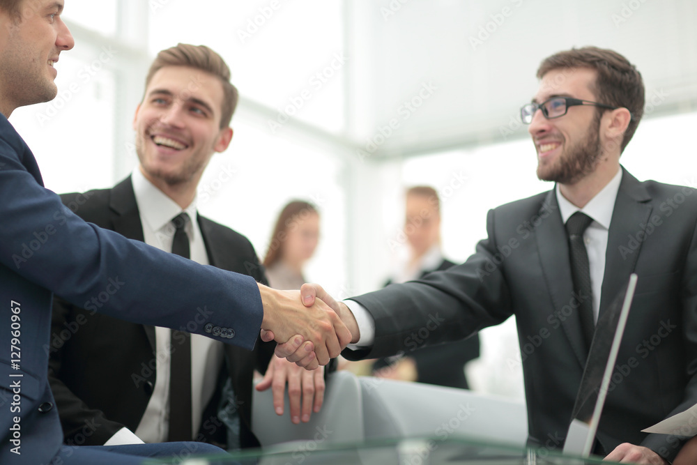 Businessman by handshake invites to cooperation. Businessman by handshake invites to cooperation.