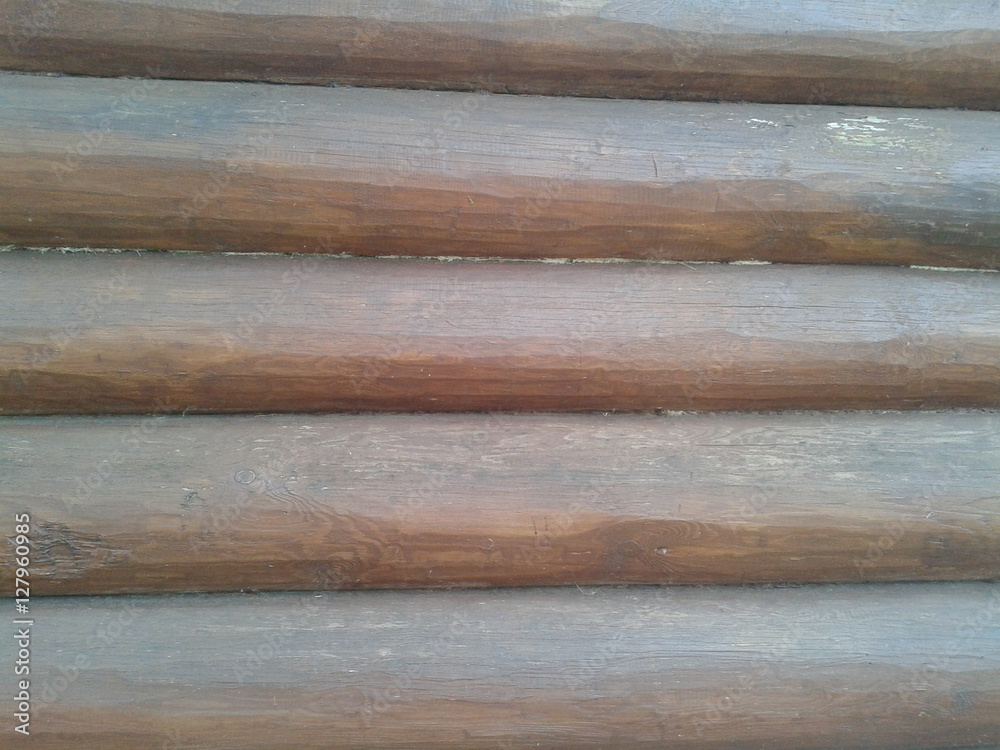 soaked brown logs in the wall of the house, a natural material, construction, masonry, round timber soaked brown logs in the wall of the house, a natural material, construction, masonry, round timber