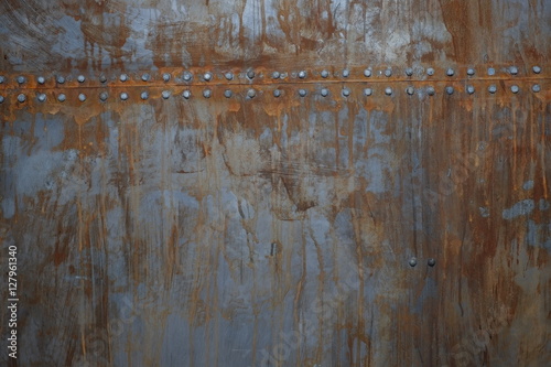 rusty metal with rivets