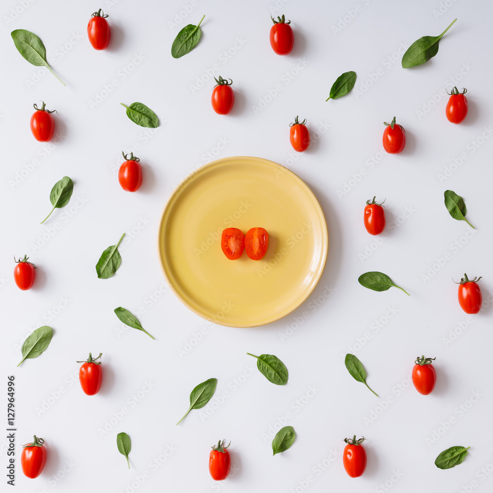 Cherry tomatoes and basil leaves pattern. Cherry tomatoes and basil leaves pattern.