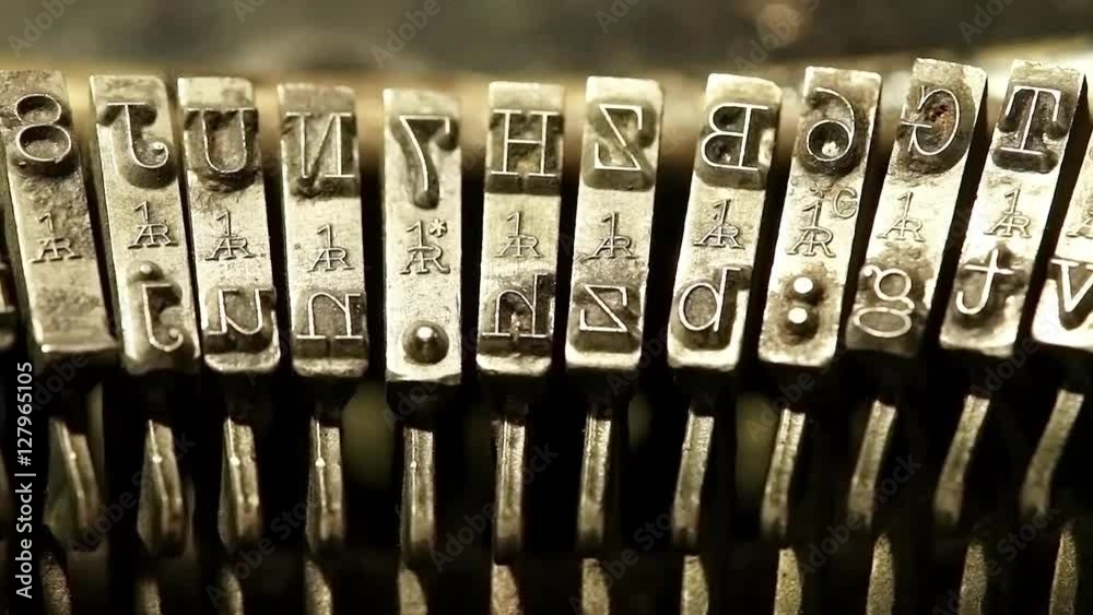 Typing with old typewriting machine, vintage device