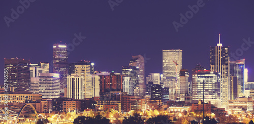 Vintage toned Denver downtown skyline at night, USA.