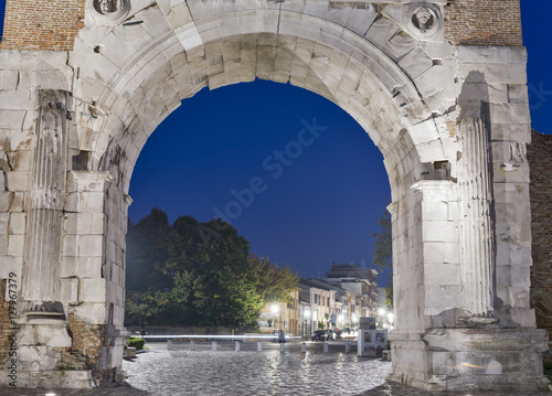 Arch of Augustus at night in Rimini, Italy