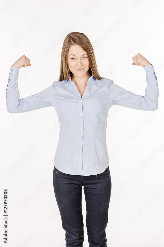 young woman showing muscle biceps with smiling. young woman showing muscle biceps with smiling.