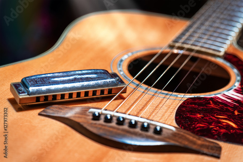 Acoustic guitar with blues harmonica country photo