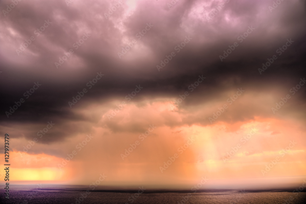 Fototapeta premium Storm sunrise over the sea