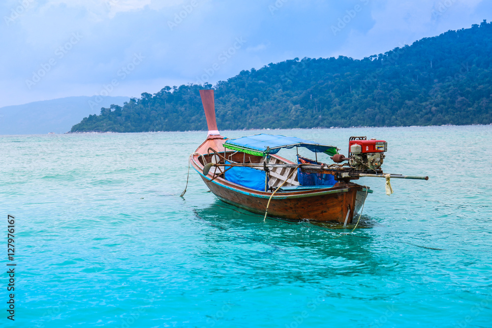Beautiful view of sea with traditional long tail boats Beautiful view of sea with traditional long tail boats