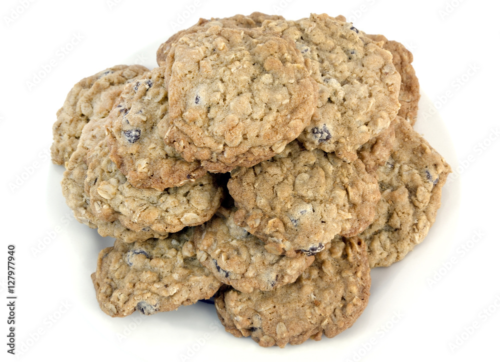 Stack of homemade oatmeal raisin cookies on a white background. Horizontal. Stack of homemade oatmeal raisin cookies on a white background. Horizontal.