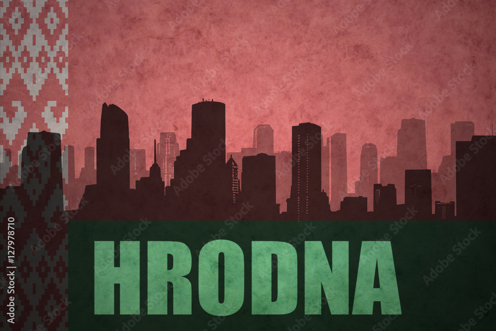 abstract silhouette of the city with text Hrodna at the vintage belarus flag