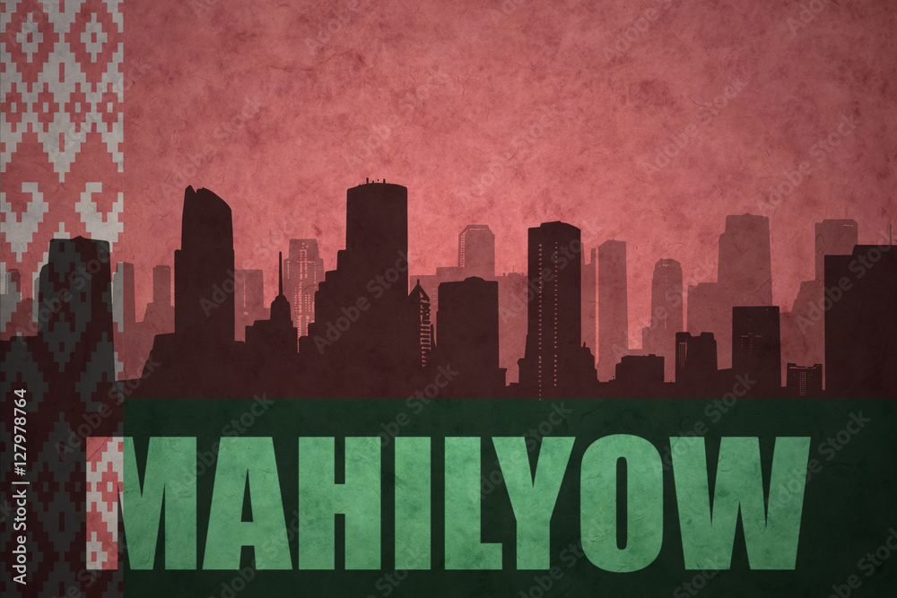 abstract silhouette of the city with text Mahilyow at the vintage belarus flag