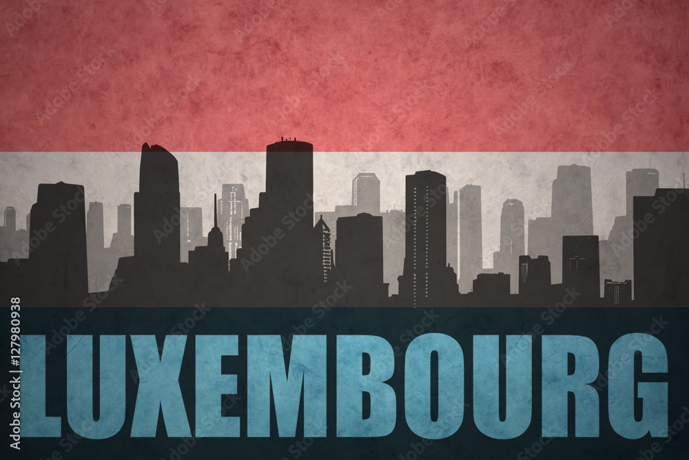 abstract silhouette of the city with text luxembourg at the vintage luxembourg flag