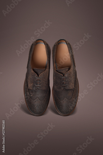men suede shoes red background
