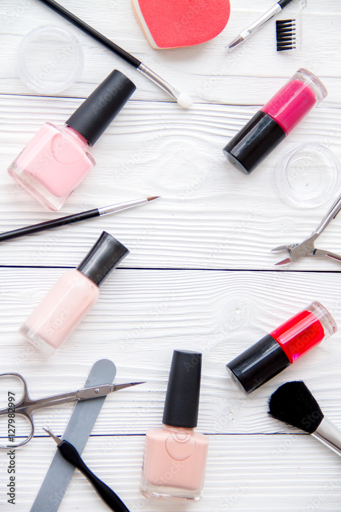 set for manicure and make-up on wooden background set for manicure and make-up on wooden background