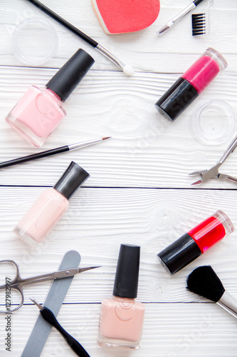 set for manicure and make-up on wooden background