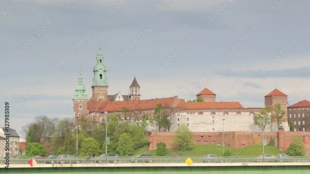 Krakow cityscape with regular traffic and Wawel royal castle, Poland Krakow cityscape with regular traffic and Wawel royal castle, Poland