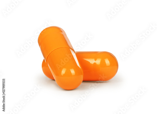 Close-up two medical capsules isolated on white background